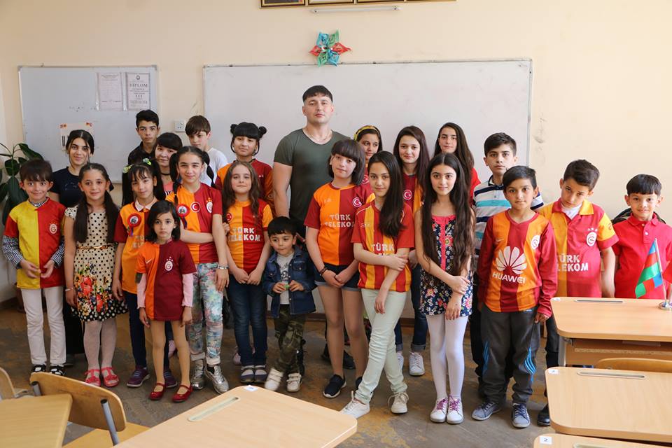 Roshan Azizov with his students.