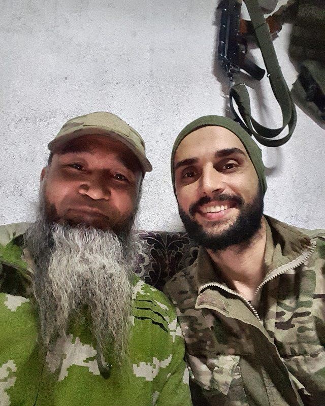 Emrah Çelik, a Turkish volunteer posing with a Central Asian volunteer, both members of Sultan Murad Division, July 2, 2019 (Photo used with permission, courtesy of Bellingcat)