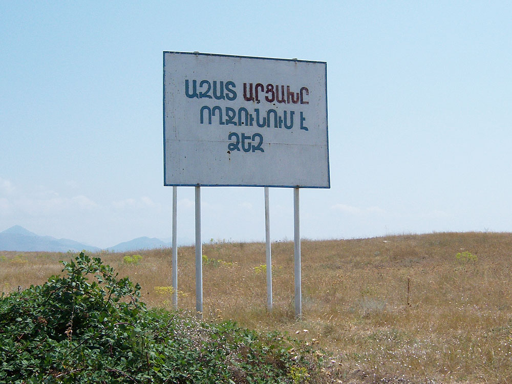 “Free Artsakh welcomes you” sign (Photo: 517design/Wikimedia Commons)